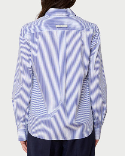 Person wearing a blue and white striped shirt against a plain background