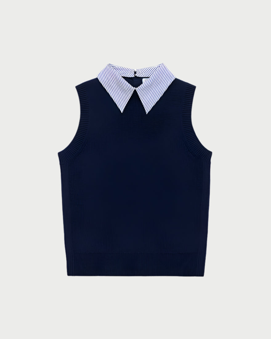 The School Vest Navy by WE-AR4, a navy blue merino wool sleeveless sweater, is paired with a white and blue collared shirt underneath, showcasing modern prep style against a plain white background.