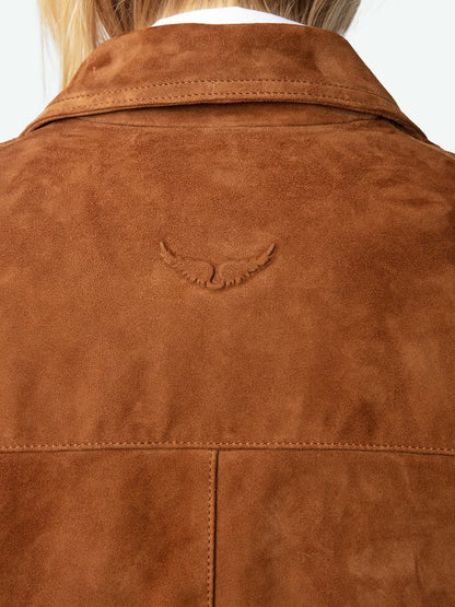 Close-up of a brown suede jacket with a brand logo on a white background