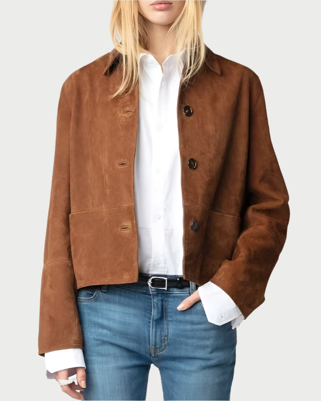 Person wearing a brown jacket, white shirt, and blue jeans on a white background