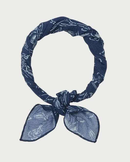 Blue patterned headscarf on a beige background