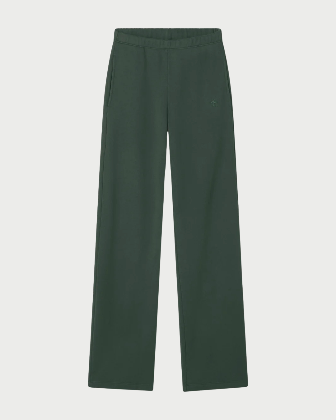 The Éterne Oversized Wide Leg Sweatpant by Eterne is shown in dark green, featuring an elastic waistband and side pockets, laid flat on a white background.