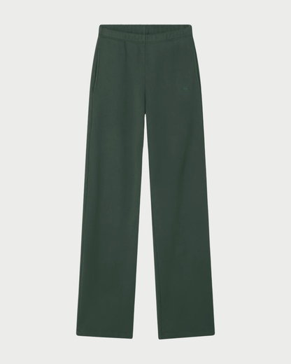 The Éterne Oversized Wide Leg Sweatpant by Eterne is shown in dark green, featuring an elastic waistband and side pockets, laid flat on a white background.