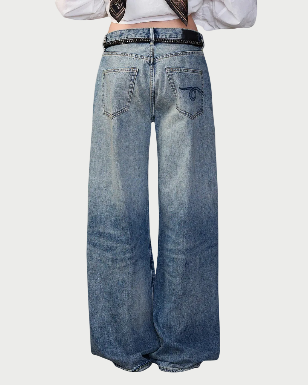 Wide-leg jeans worn by a person on a white background