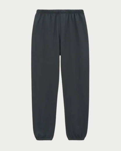 The perfectwhitetee Johnny Sweatpant in Vintage Black features a classic jogger silhouette with an elastic waistband and elastic cuffs at the ankles, crafted from French terry for everyday comfort—shown here against a white background.