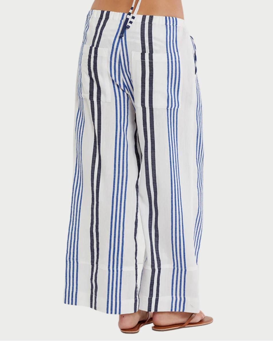 Person wearing blue and white striped pants on a white background