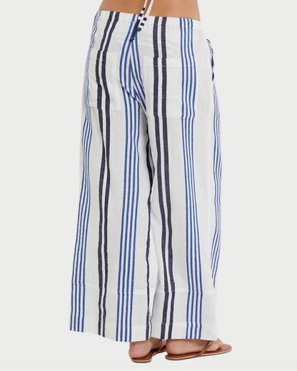 Person wearing blue and white striped pants on a white background