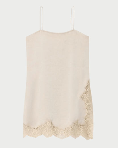 A light beige knit camisole top with thin spaghetti straps and a scalloped lace hem, shown against a plain light gray background.