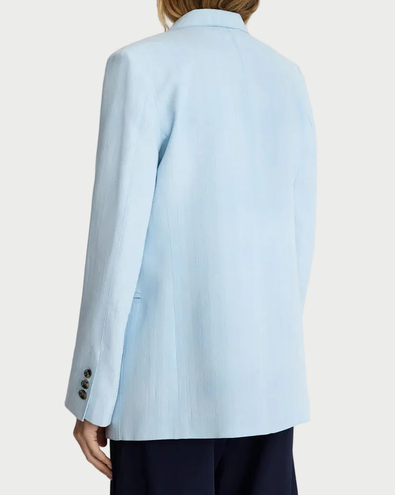Light blue blazer worn by a person on a plain background