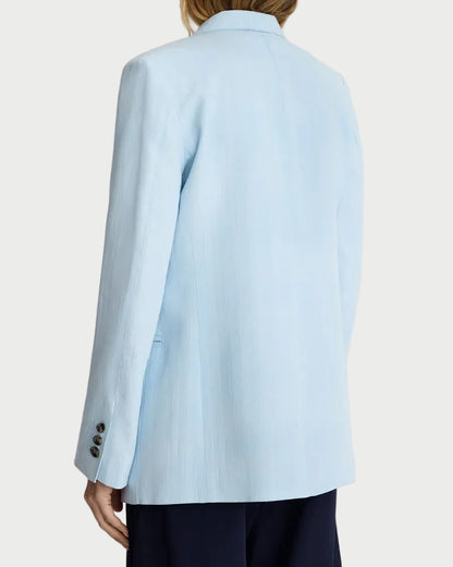 Light blue blazer worn by a person on a plain background