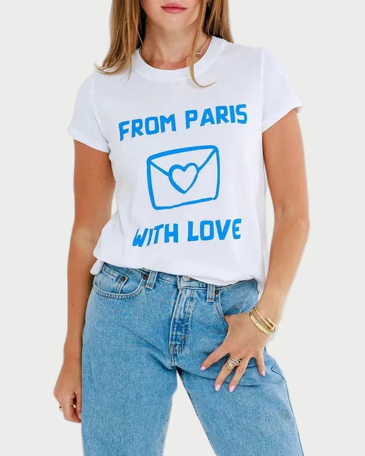 Woman wearing a white t-shirt with text and blue jeans on a light gray background