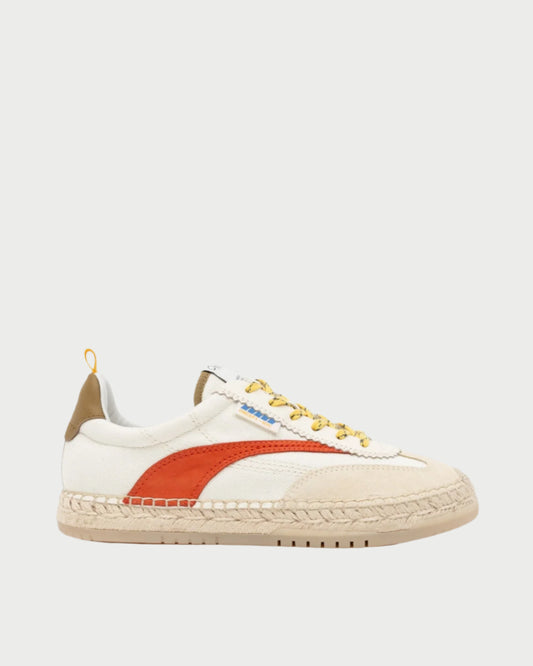 The St Tropez Sneaker by Oncept features a beige upper with an orange side stripe, complemented by matching laces, a woven-texture sole, and a brown heel patch, making it ideal for casual wear.