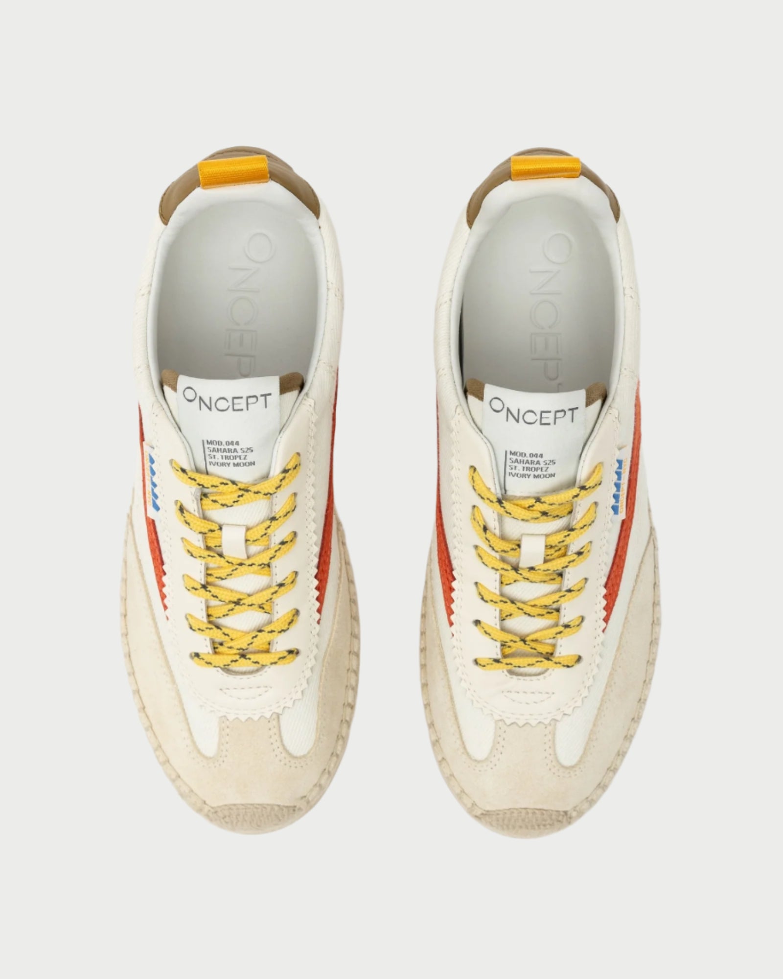 The St Tropez Sneaker by Oncept features a top view of versatile white design with red zigzags on the sides, yellow and gray laces, visible branding on the tongue and insole, beige soles, and a stylish blue tag.