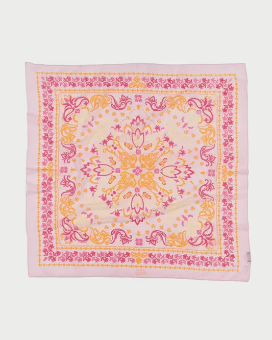 The Maison Lecomte Flament Noirmoutier Bandana Scarf is a chic square accessory with ornate floral and paisley prints in pink, yellow, and orange on a light background, finished with pink edges—a French-inspired piece from Maison Lecomte Flament.