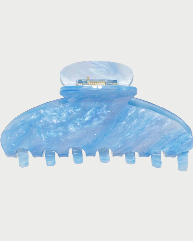Blue hair clip on a white background