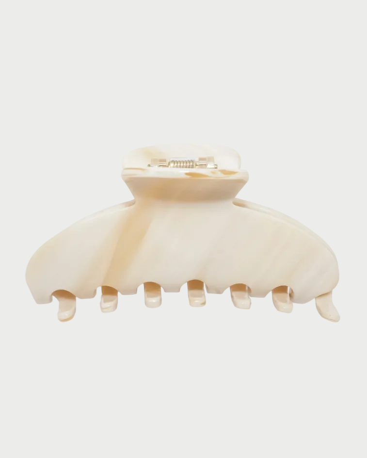 Beige hair clip on a white background