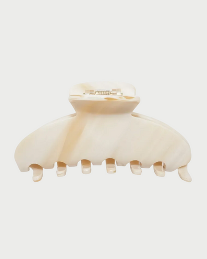 Beige hair clip on a white background