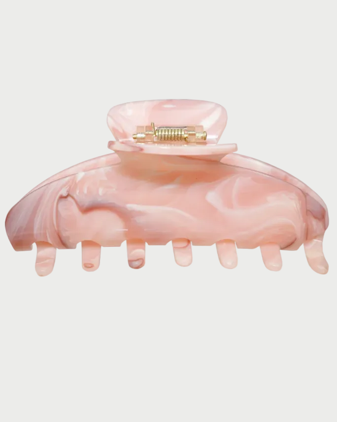 Pink hair clip on a white background with 'Award Winner' text above.
