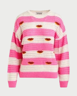 Pink and white striped sweater with lip prints on a white background