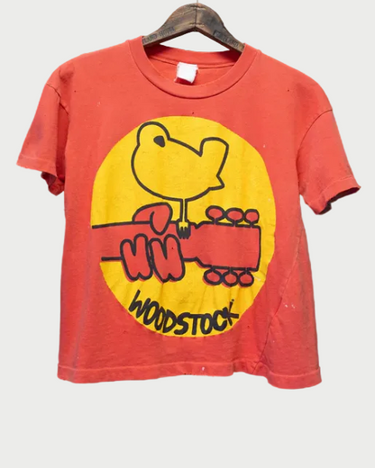Red t-shirt with yellow graphic and 'Woodstock' text on a dark textured background