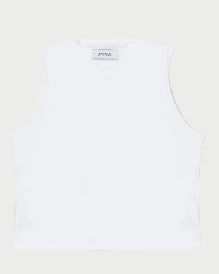 Sleeveless white crew neck cotton SPRWMN Muscle Tee with a straight hem, shown on a plain background. A small inner collar tag displays the SPRWMN brand name.