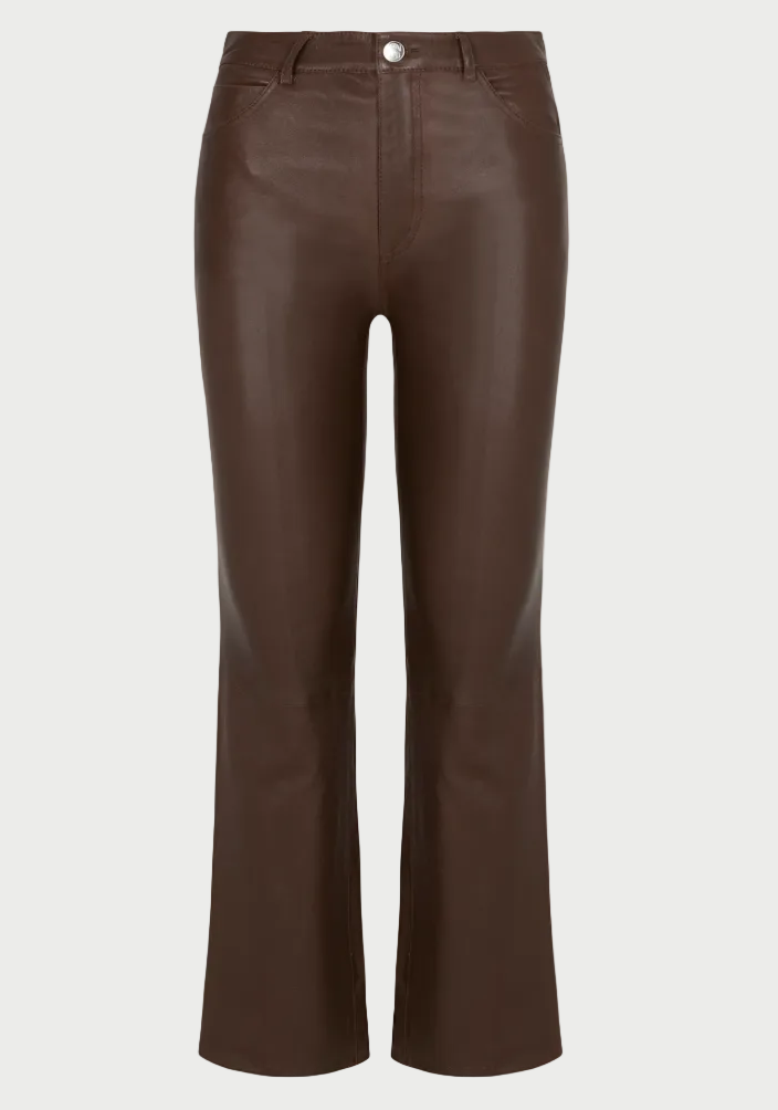 The SPRWMN 5 Pocket Ankle Flare by SPRWMN features high-waisted brown leather, a button and zip closure, front pockets, and subtly flared ankles, shown against a white background.