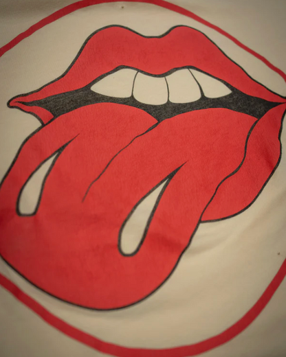 Red lips with a tongue sticking out on a beige background