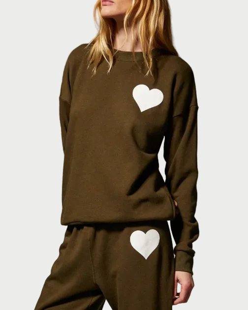 Olive green SPRWMN Heart Sweatshirt and matching pants, both featuring a white heart graphic.
