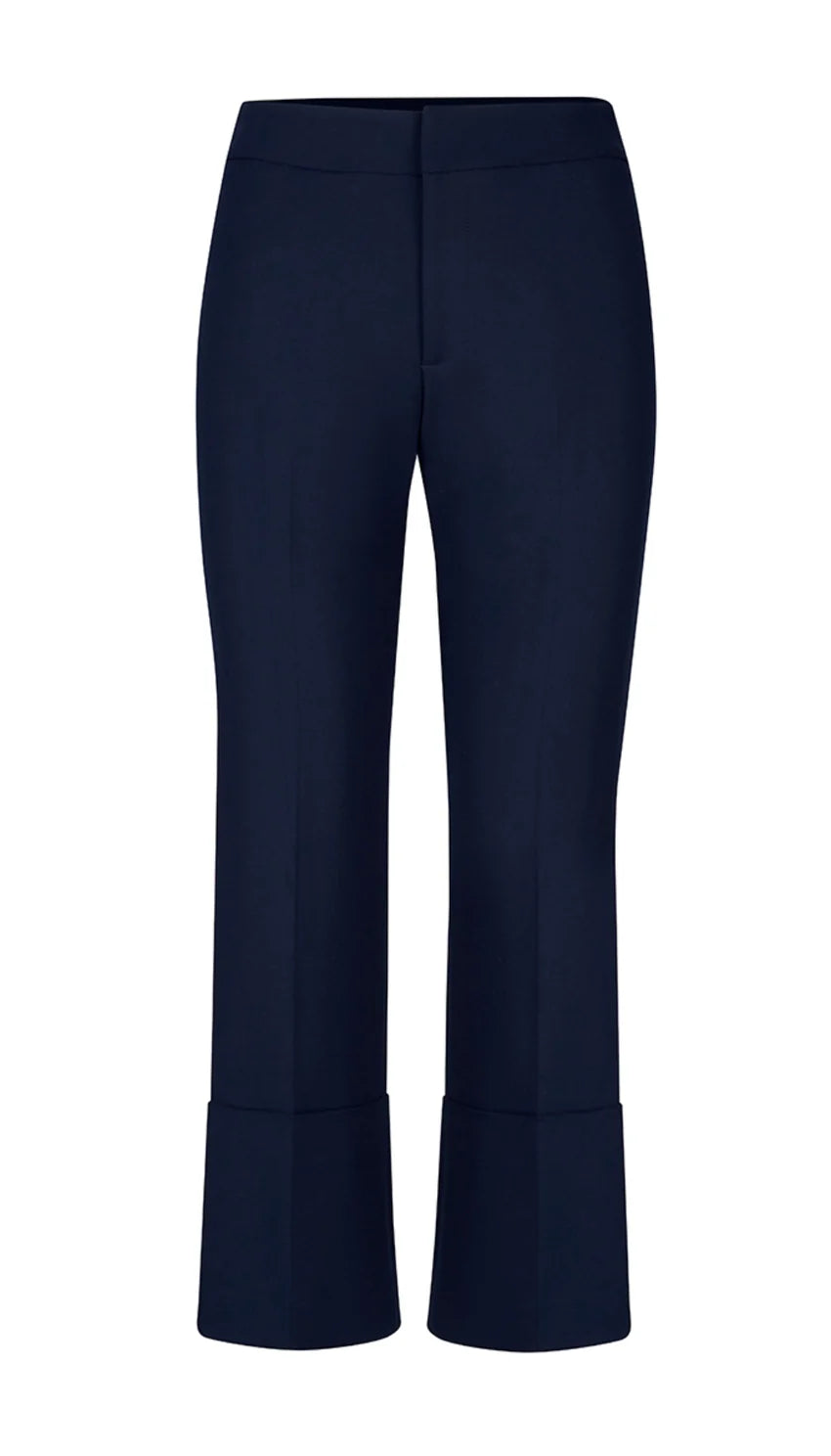 Smythe's Cuffed Flood Pant in Deep Navy features tailored mid-rise cropped trousers with wide, flood pant-inspired cuffs, shown against a plain white background.