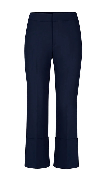 Smythe's Cuffed Flood Pant in Deep Navy features tailored mid-rise cropped trousers with wide, flood pant-inspired cuffs, shown against a plain white background.