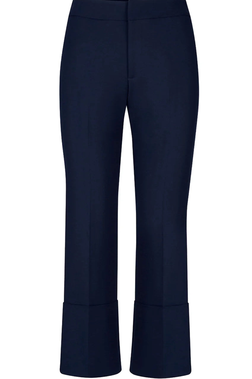 Smythe's Cuffed Flood Pant in Deep Navy features tailored mid-rise cropped trousers with wide, flood pant-inspired cuffs, shown against a plain white background.