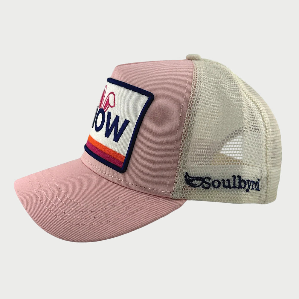 Pink cap with a mesh back and logo patch on a white background