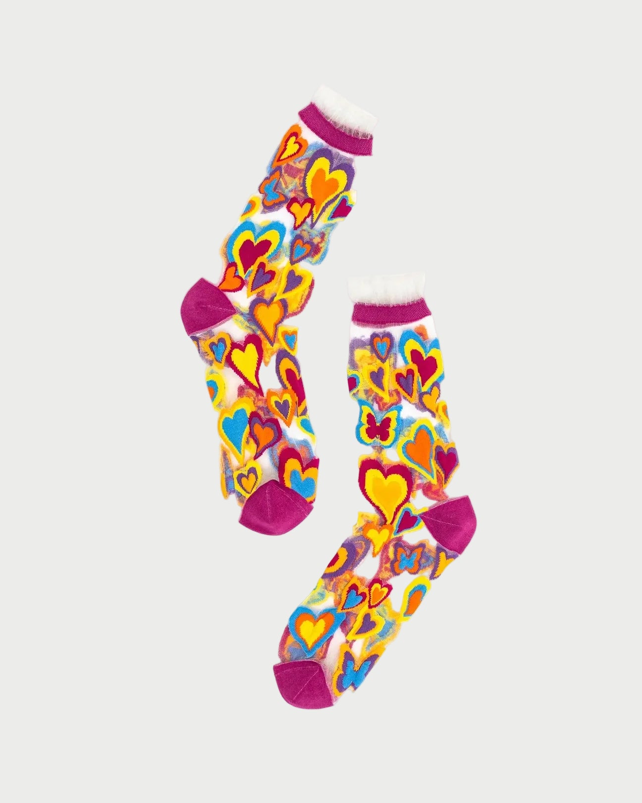 Colorful heart-patterned socks on a white background