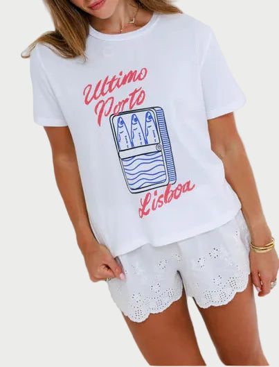 Woman wearing a white t-shirt with red text and graphics on a plain background