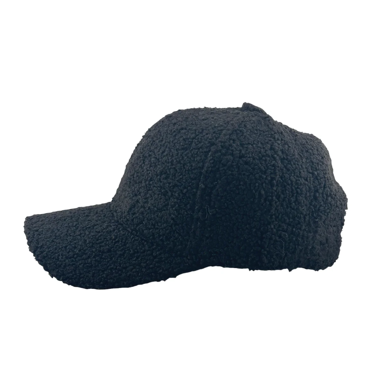 This comfortable Teddy Trucker Hat by Soulbyrd, featuring a black textured baseball cap with a curly, fleece-like material, is elegantly showcased in profile on a plain white background, capturing the essence of Soulbyrd LA's iconic style.
