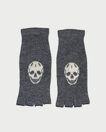 Pair of gray fingerless gloves with skull designs on a marble surface