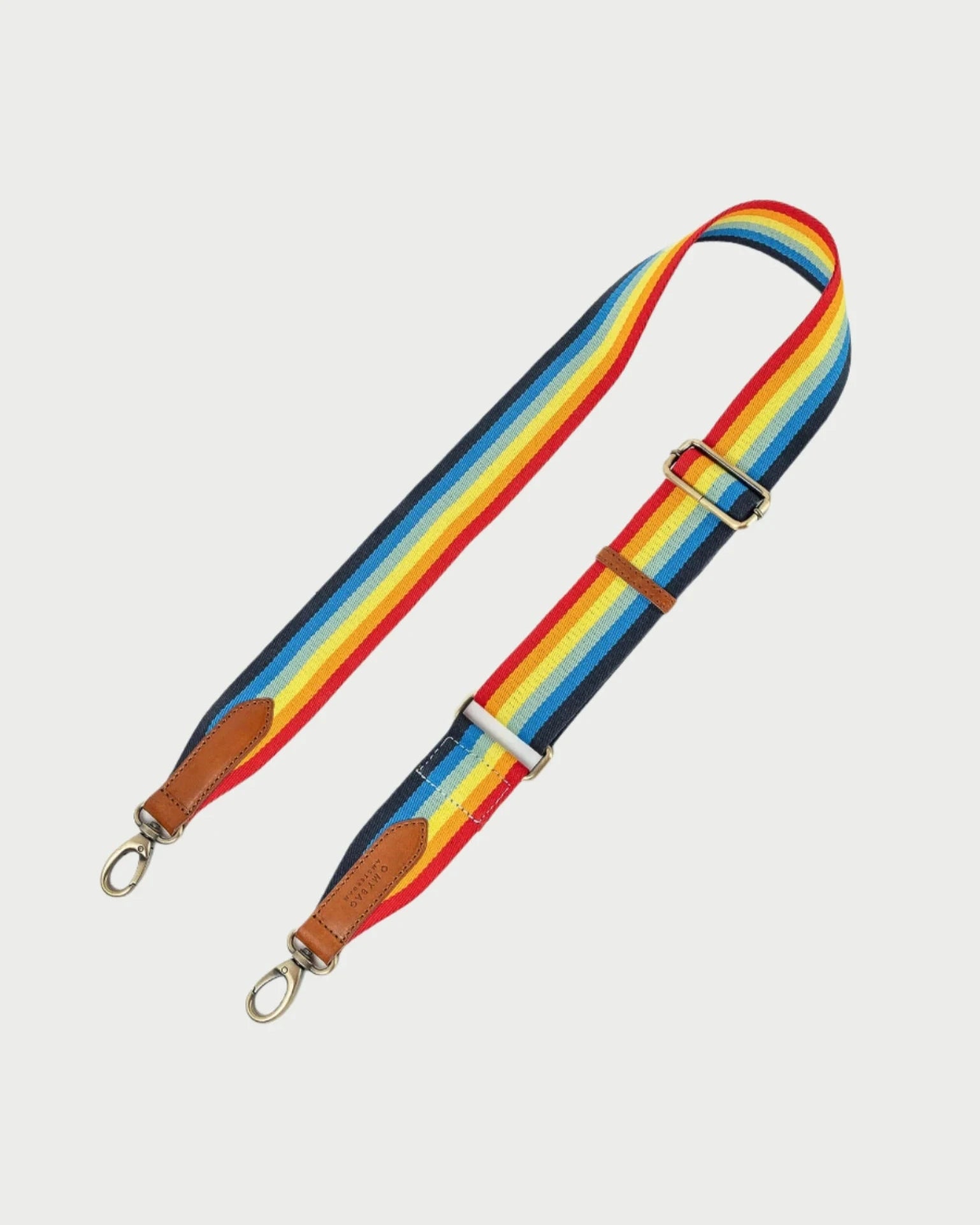 Introducing the vibrant O MY BAG Webbing Strap, adorned with striking red, yellow, blue, and black stripes made from organic dyes. This adjustable strap features brown leather ends and silver clips for effortless attachment to any bag.