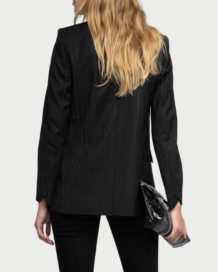 Person wearing a black suit on a white background