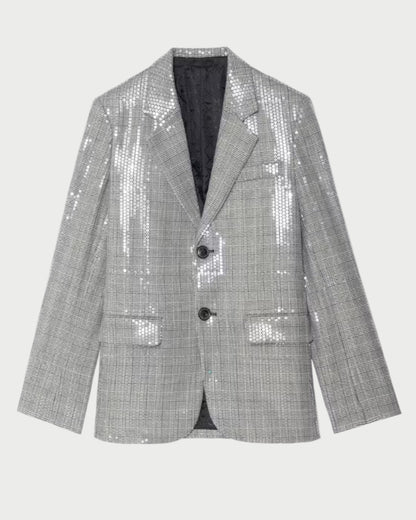 The Zadig & Voltaire Vanille Sequin Blazer features a silver Prince of Wales check, notched lapels, two black buttons, flap pockets, and subtle sequin embellishments, shown against a plain light background.