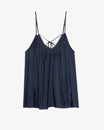 Navy blue slip dress with thin straps on a white background