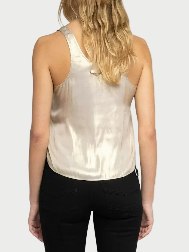 Woman wearing a white halter top and black pants on a white background