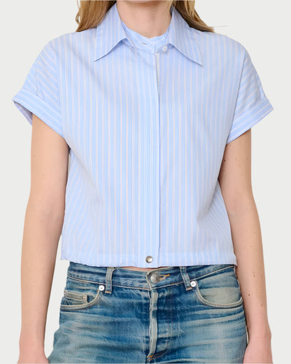 Someone wears the WE-AR4 Bungee Short Sleeve Shirt, light blue with white vertical stripes and a detachable collar, paired with blue jeans.
