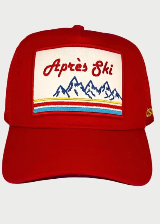 The Soulbyrd Apres Ski Red Trucker Hat features a patch with blue mountain artwork and colorful stripes—an embroidered essential from Soulbyrd, perfect for your ski lodge adventures.