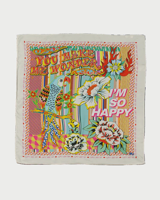 Colorful towel with floral designs and text on a white background