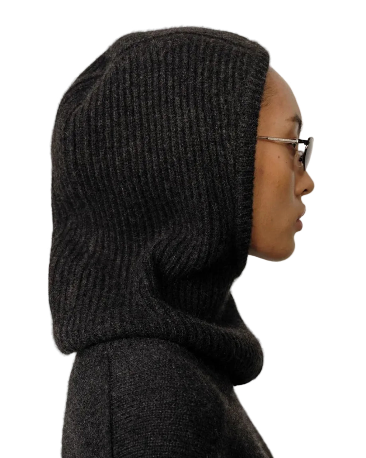 A person in profile, wearing glasses and the Herskind Cashmere Balaclava by Herskind, is set against a white background, highlighting this minimalist winter accessory.