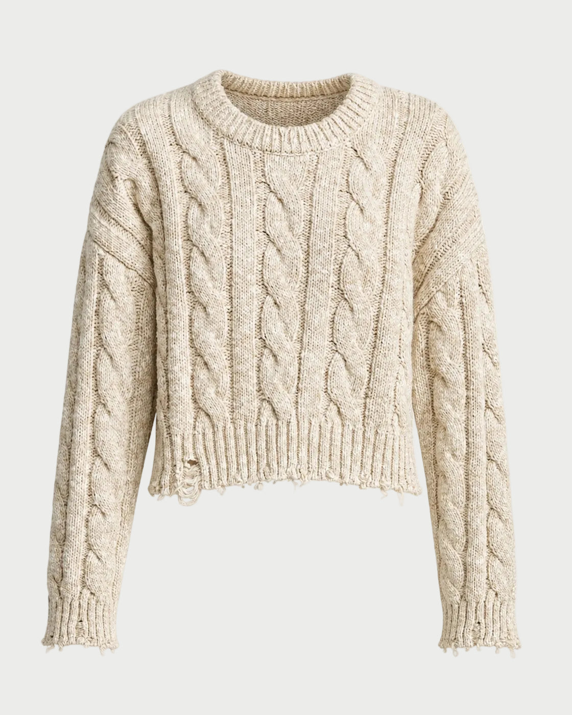 A cropped cable-knit sweater in a warm cream or oatmeal beige color, featuring a crew neck and ribbed hem and cuffs, shown against a plain white background.