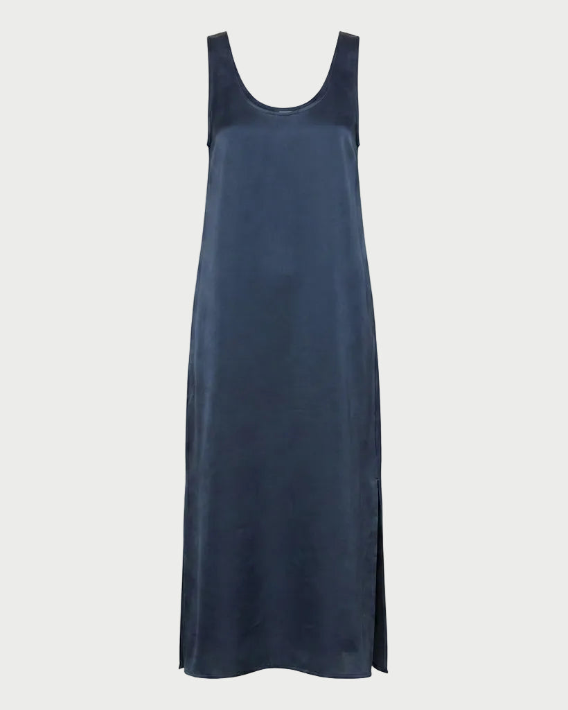 The Saint Art James Maxi Dress by Saint Art NY is a navy blue, sleeveless slip dress with a scoop neckline and side slits, crafted in shiny satin-look charmeuse—perfect for elegant events. Shown on a plain white background.