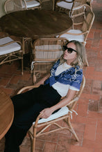 Load image into Gallery viewer, lounging in the beautiful french designed cashmere and wool bandana scarf at west2westport.com