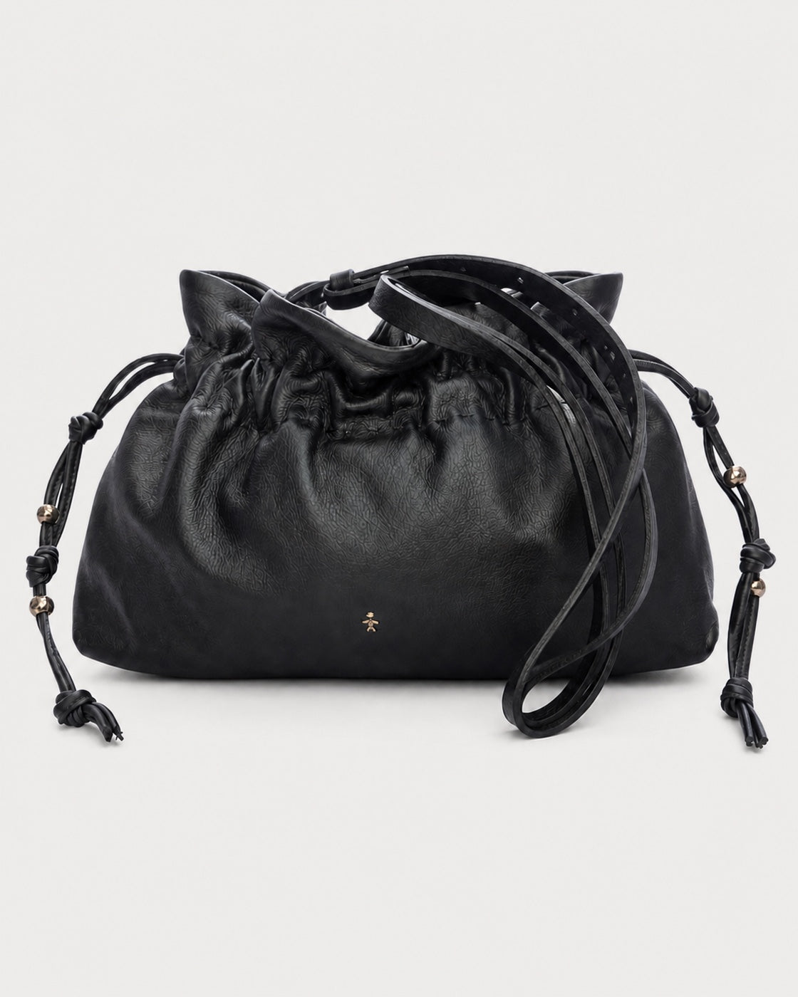 The Henry Beguelin Floriana Clutch is a handcrafted luxury handbag by Henry Beguelin, showcasing a black leather drawstring design with knotted side details, gold bead accents, and a small gold star logo on the front. Expertly made from premium Italian leather, the clutch is photographed against a plain light background.