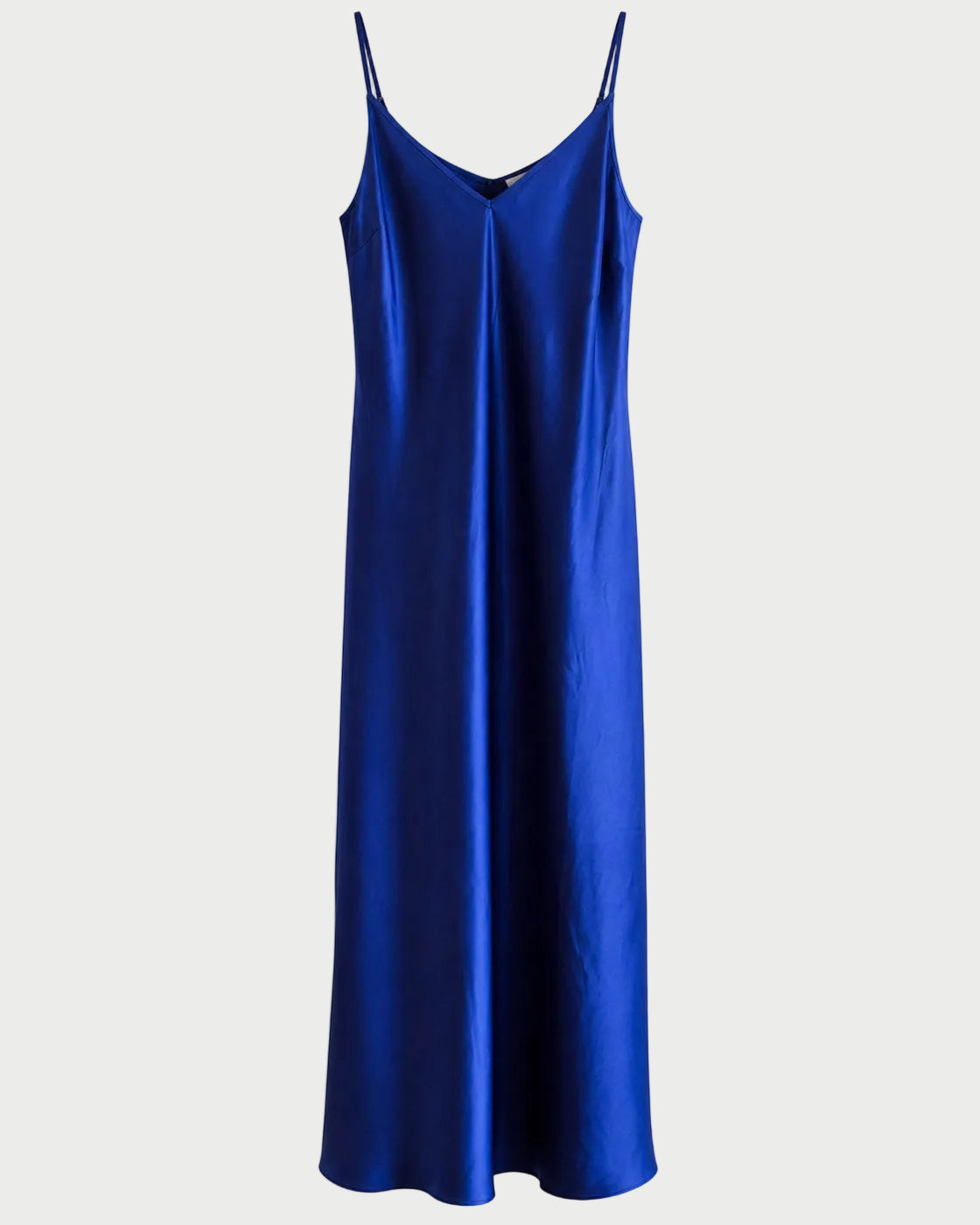 A royal blue satin slip dress with thin spaghetti straps and a V-neckline, shown against a plain white background.